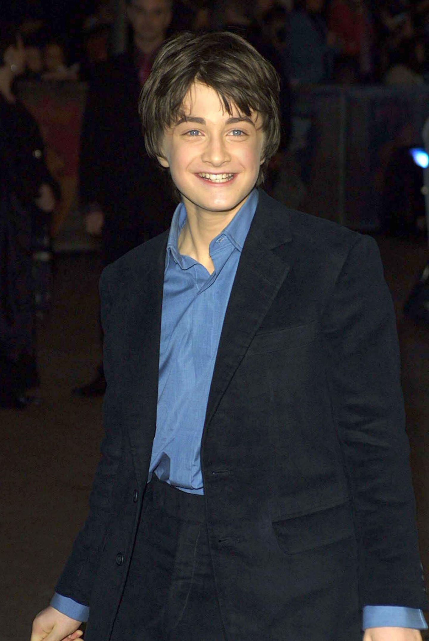 Kinderstars: Daniel Radcliffe lächelt auf dem roten Teppich.